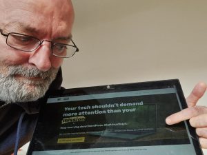 Seán with his laptop showing the WPforGood website
